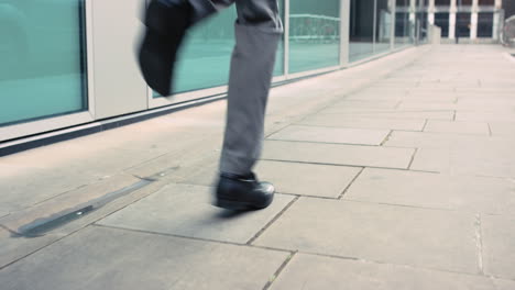 contemporary funky caucasian businessman street dancer dancing freestyle in the city