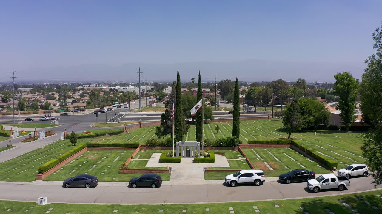Aerial close-up and pushing in shot of a Veteran's War Memorial at a California mortuary