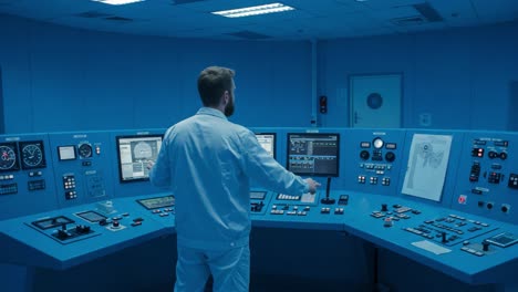 a focused technician monitors and controls an advanced technological console, ensuring precise operations in a state-of-the-art control room environment