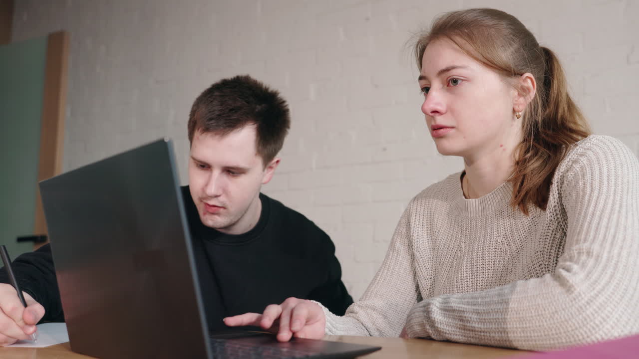 Couple working on laptop together