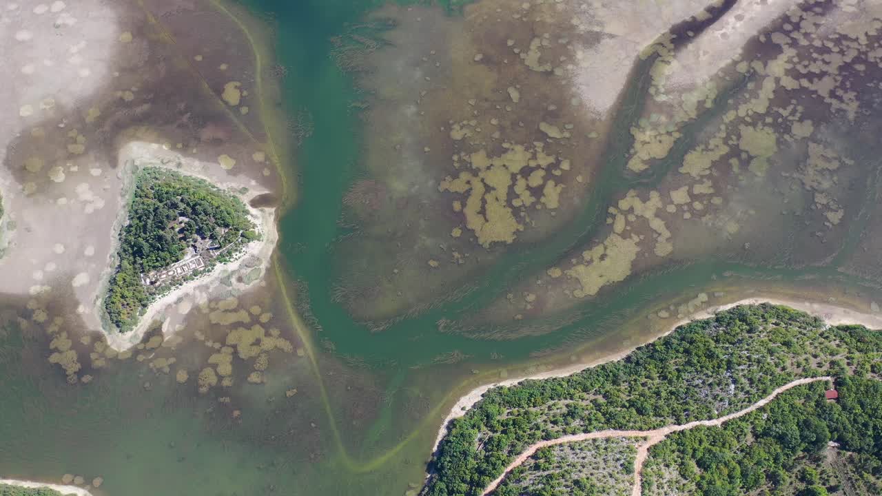Prolosko Blato Jezero swamp area lake in Croatia near the Bosnian border, Aerial top view lowering shot