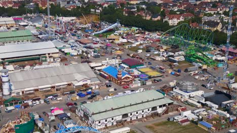 Gorgeous-aerial-top-view-flight-Theresienwiese-october-festival,-sunny-day-before-opening