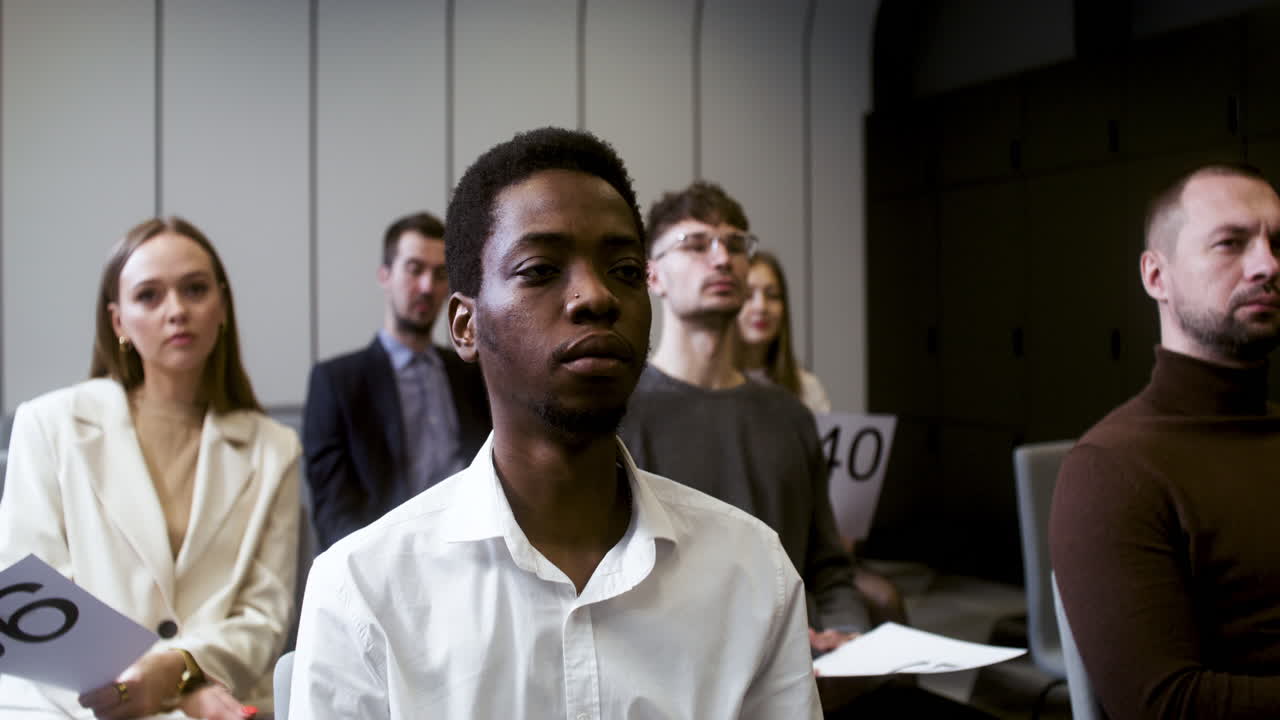 People in an auction session