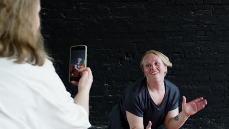 woman recording video indoors