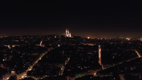 night view of the basilica in paris from the distance