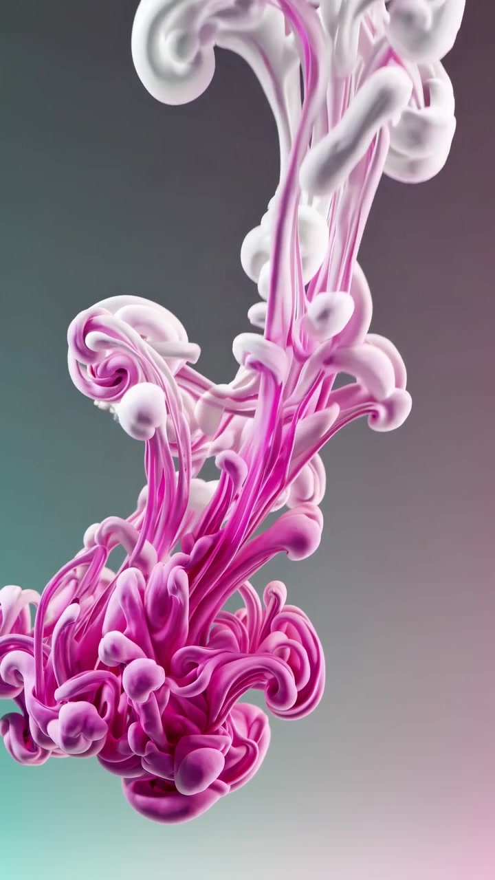 Inchiostro rosa e bianco che si mescola nel liquido
