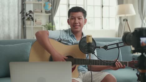 Teenager Plays Acoustic Guitar for Online Audience