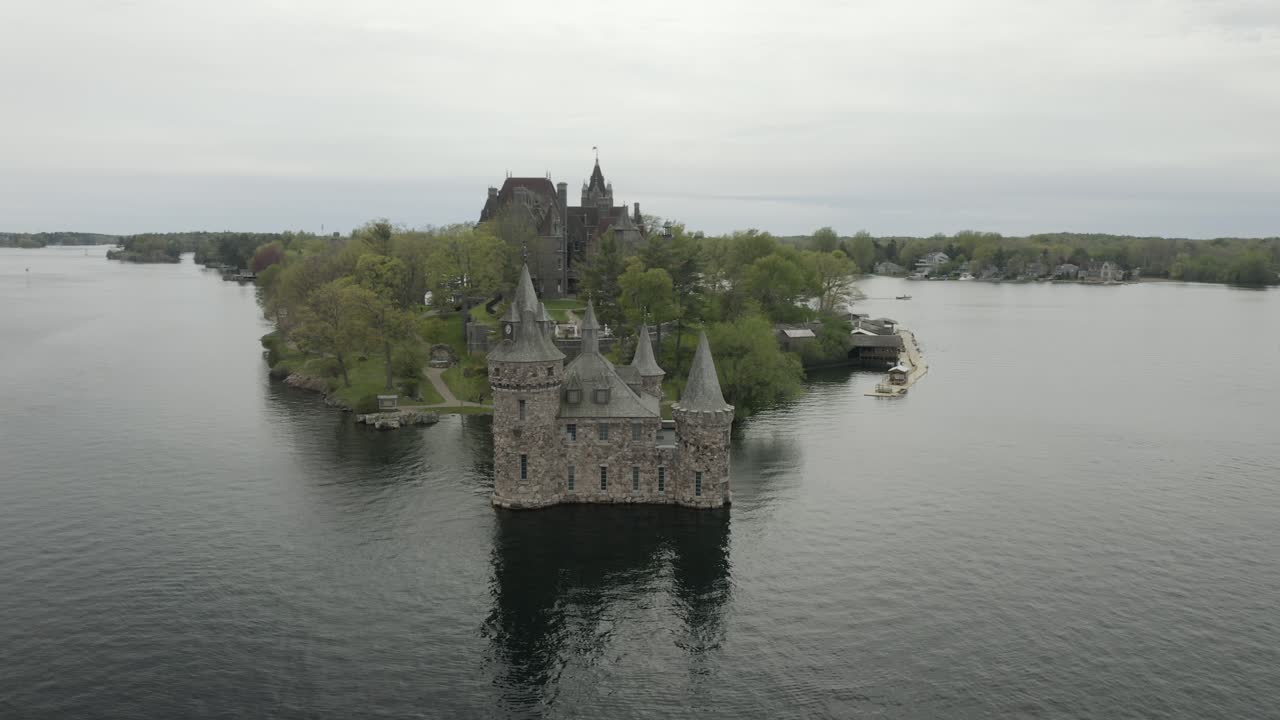 Drone shot of a castle in Thousand Islands, close up, flying to the right and panning left