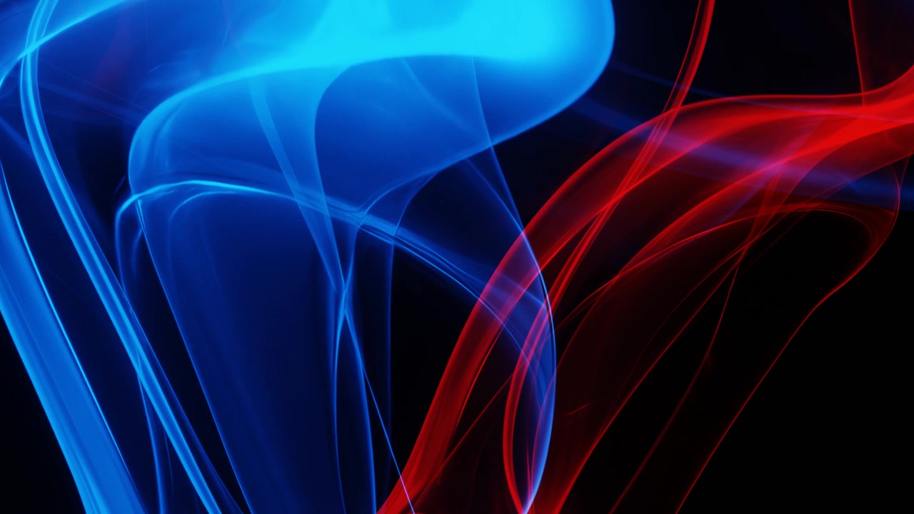 Abstract blue and red smoke wisps on black background