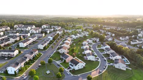 aerial shot of american neighborhood during golden sunset