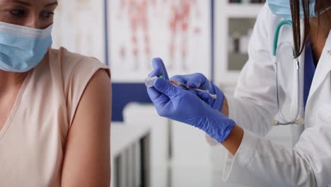 video of doctor vaccinates a patient in a doctor's office