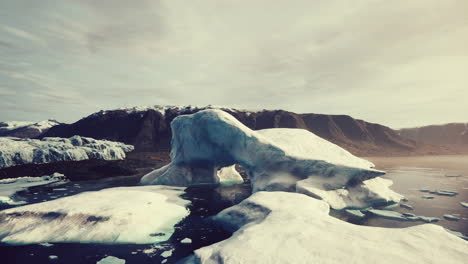 Close-up-of-iceberg-on-black-sand-shore