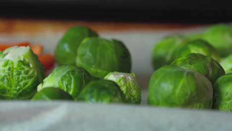 Close-up-brussels-sprouts-and-carrots-on-a-roasting-pan