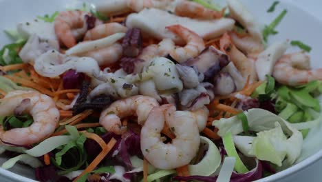 fresh salad from seafood: octopus, cuttlefish, shrimp