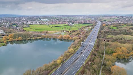 aerial drone cinematic video footage of the m1 motorway near the city of wakefield, west yorkshire, uk