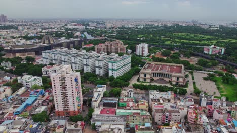 tamil nadu government medical college and multi super speciality hospital with kalaivanar arangam in chennai, tamil nadu, india. day time, semi orbit, drone shot, 4k.