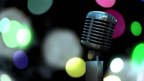 Retro-metallic-microphone-against-colorful-spots-of-light-against-black-background