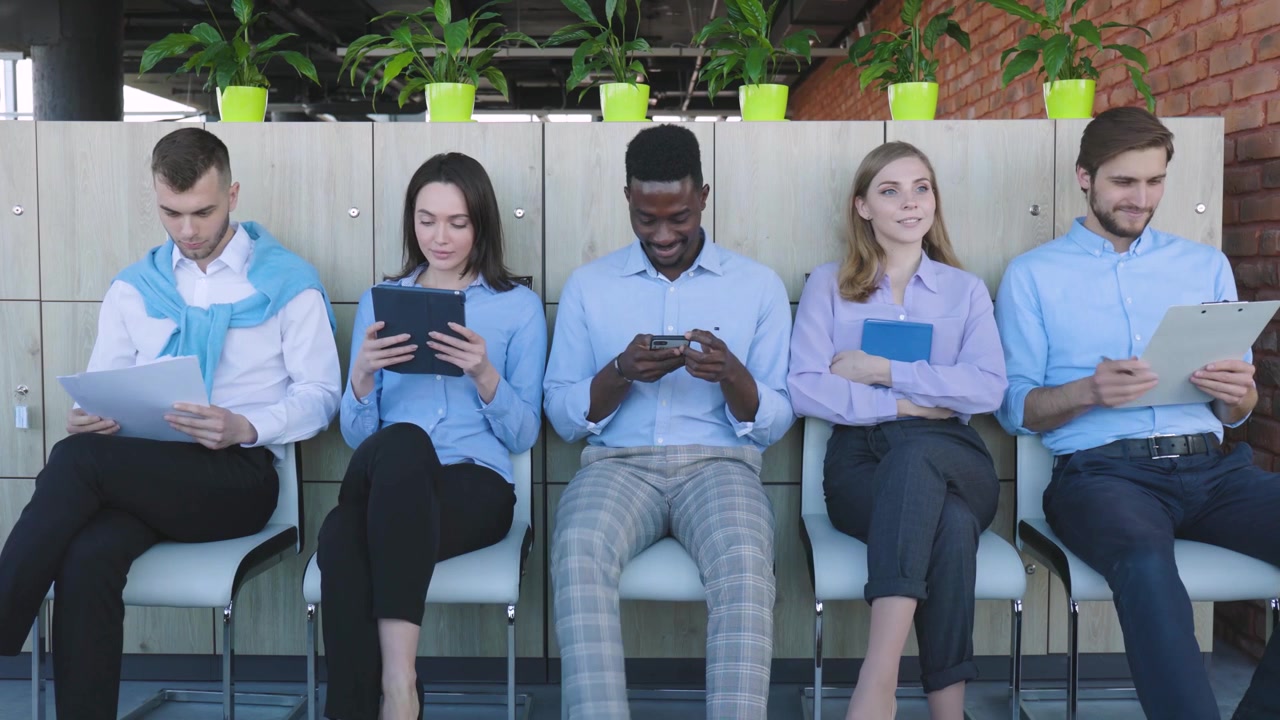 Diverse Business People Waiting and Preparing in Office Lobby