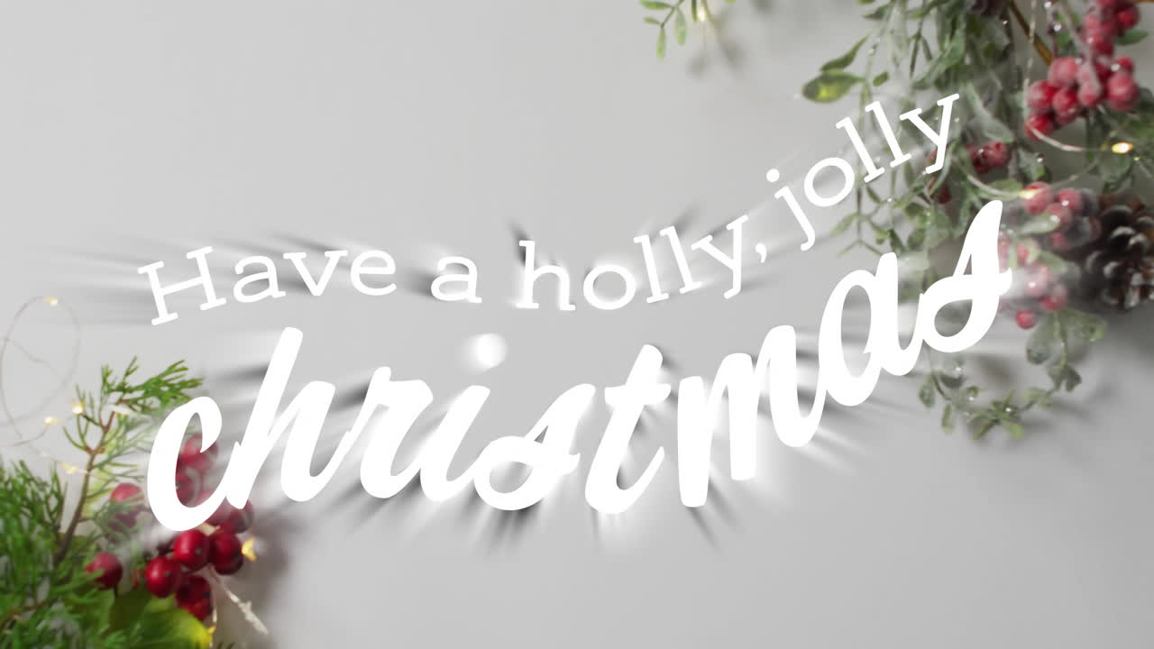 Animation of have a holly jolly christmas text over christmas decorations