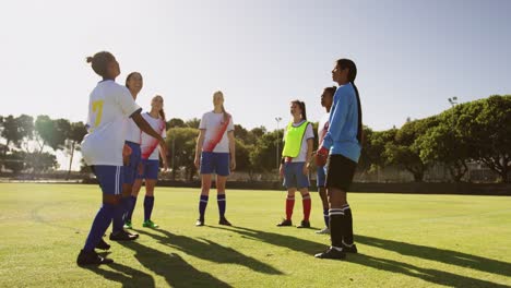 Female-soccer-team-trying-to-keep-the-ball-up-on-soccer-field.-4k