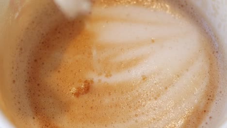 close-up of a cup of coffee with brown sugar