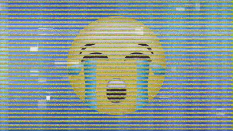 digital animation of tv static effect over crying face emoji against blue background