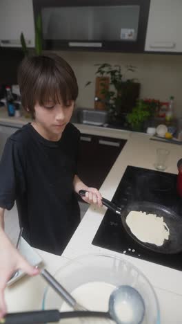 child making pancakes