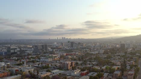 aerial, panoramic view of the cityscape and sunset, drone view