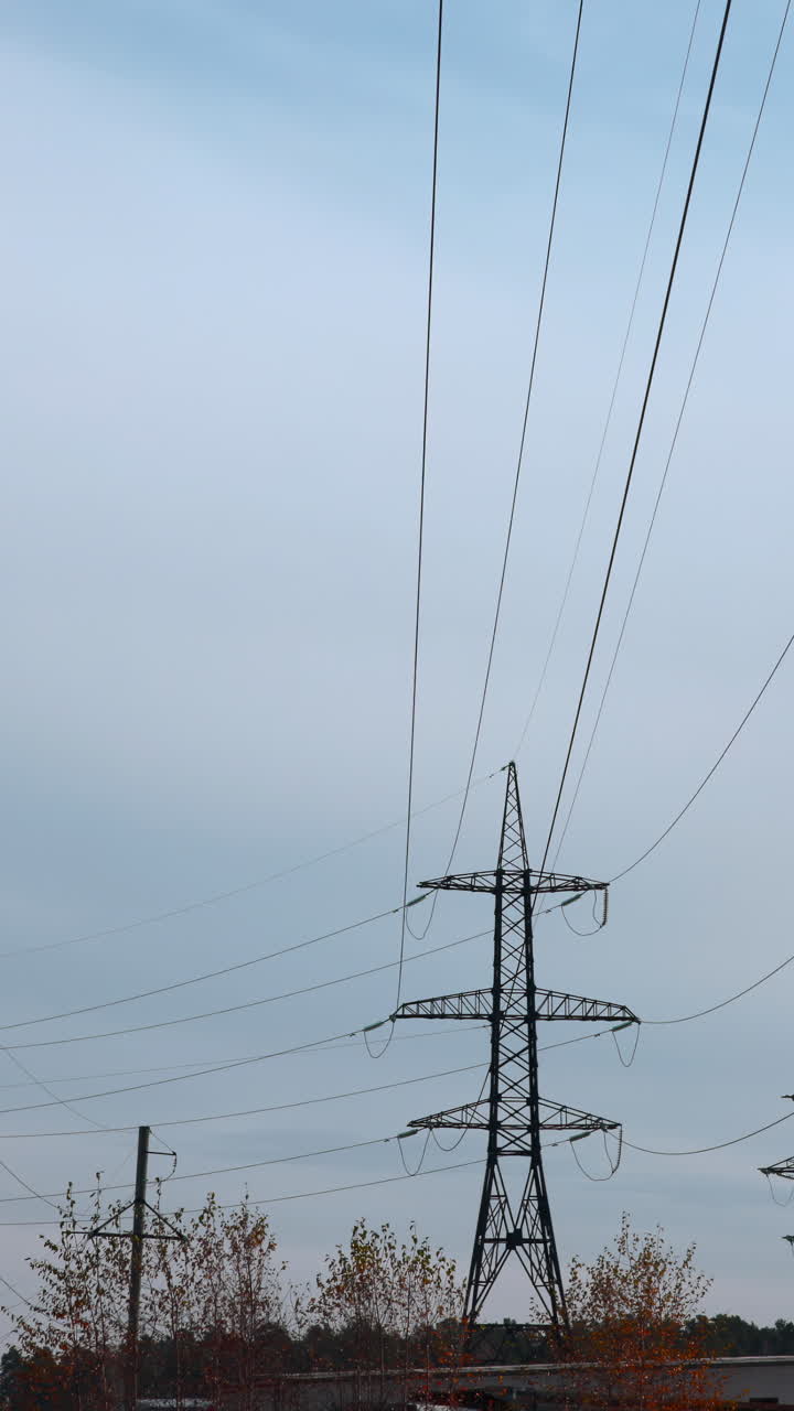 Electricity Pylon and Power Lines Against a Cloudy Sky