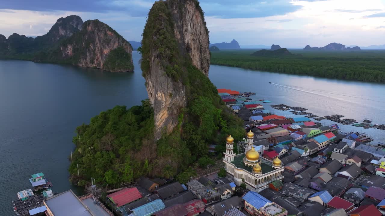 Koh Panyi's floating homes rise above Phang Nga Bay waters, Thailand