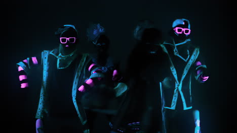 dance group in neon costumes