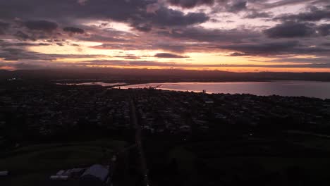 point chevalier district of auckland town with bay at sunset time