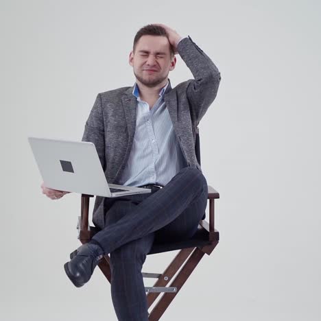 . businessman with laptop in studio. studio portrait of businessman holding laptop