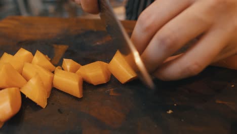 chopping carrots on wooden board