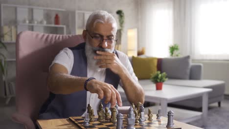 Thoughtful-man-playing-chess-and-thinking-about-his-moves.