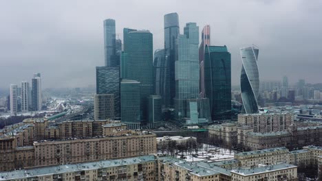 aerial drone shot of moscow city skyscrapers at cloudy winter day