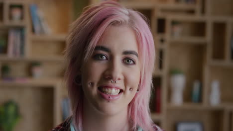 portrait of young punk woman smiling happy wearing pink funky hairstyle face piercings beautiful successful caucasian woman alternative fashion style individuality