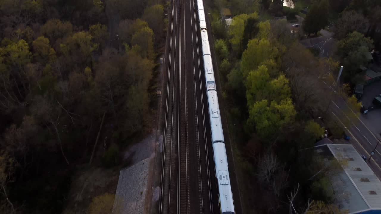 Aerial birds eye view South Western Railway train morning commute, England