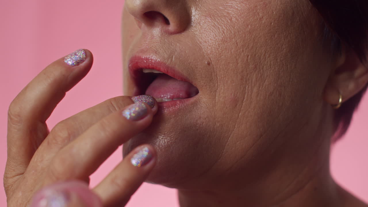 Unrecognizable Woman Using Moisturizing Lip Balm