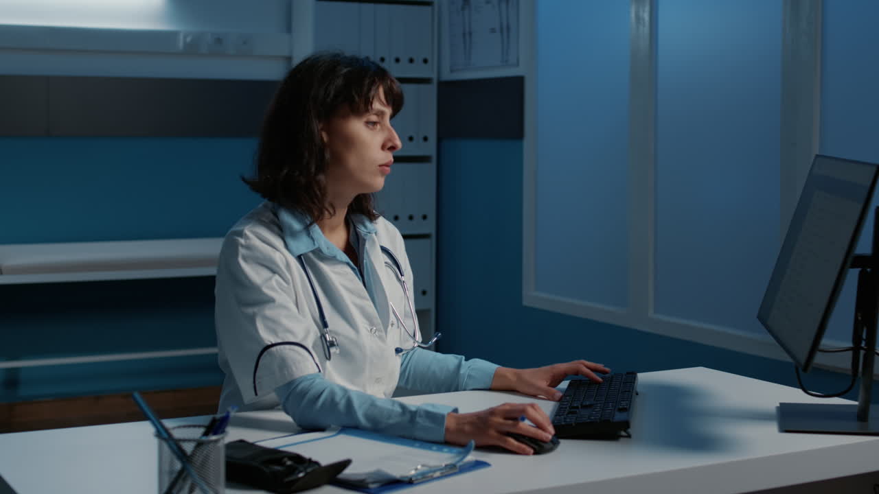 Female doctor working at desk in office