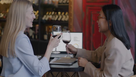 businesswomen networking over wine