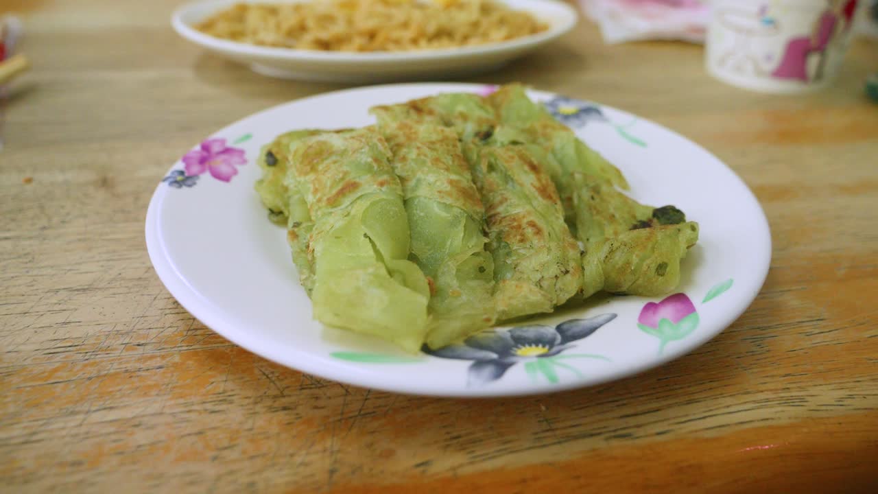 Crispy Taiwanese Gyoza Dumplings on Decorative Plate, Close Up