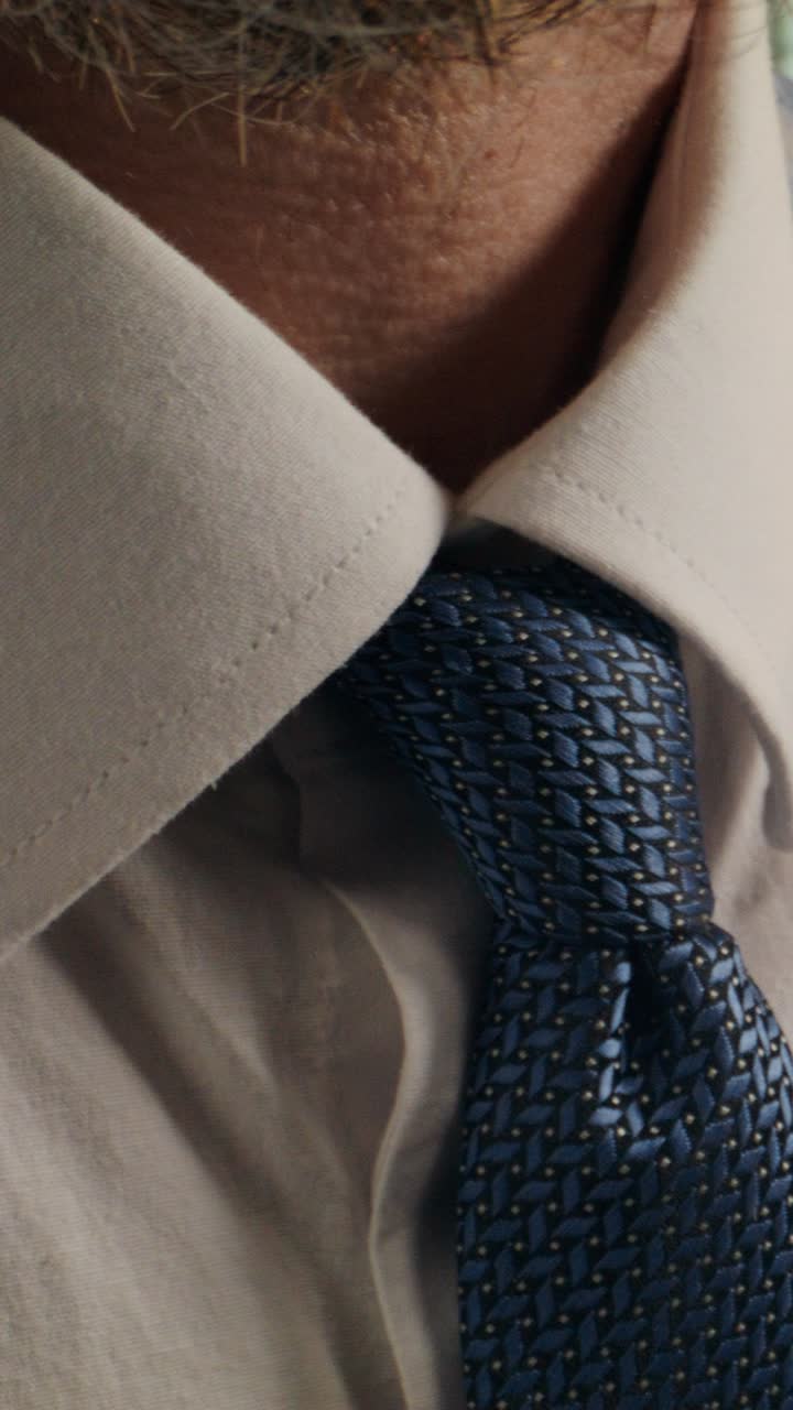 Close-up of a man's shirt and tie
