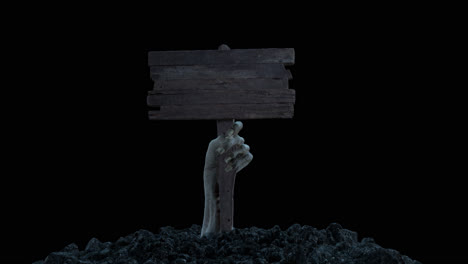 a zombie hand with a wooden sign crawls out of the ground with alpha channel