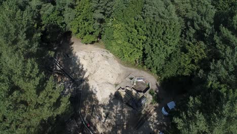 Aerial-bird's-eye-view-of-polish-boreal-forest-with-sight-seeing-location-with-tourists-in-pomerania-district,-Poland