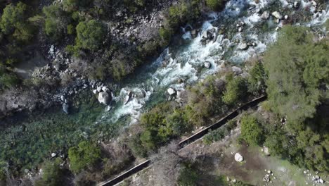 flying-over-a-beautifull-and-crystalline-river-in-the-mountains-of-southamerica