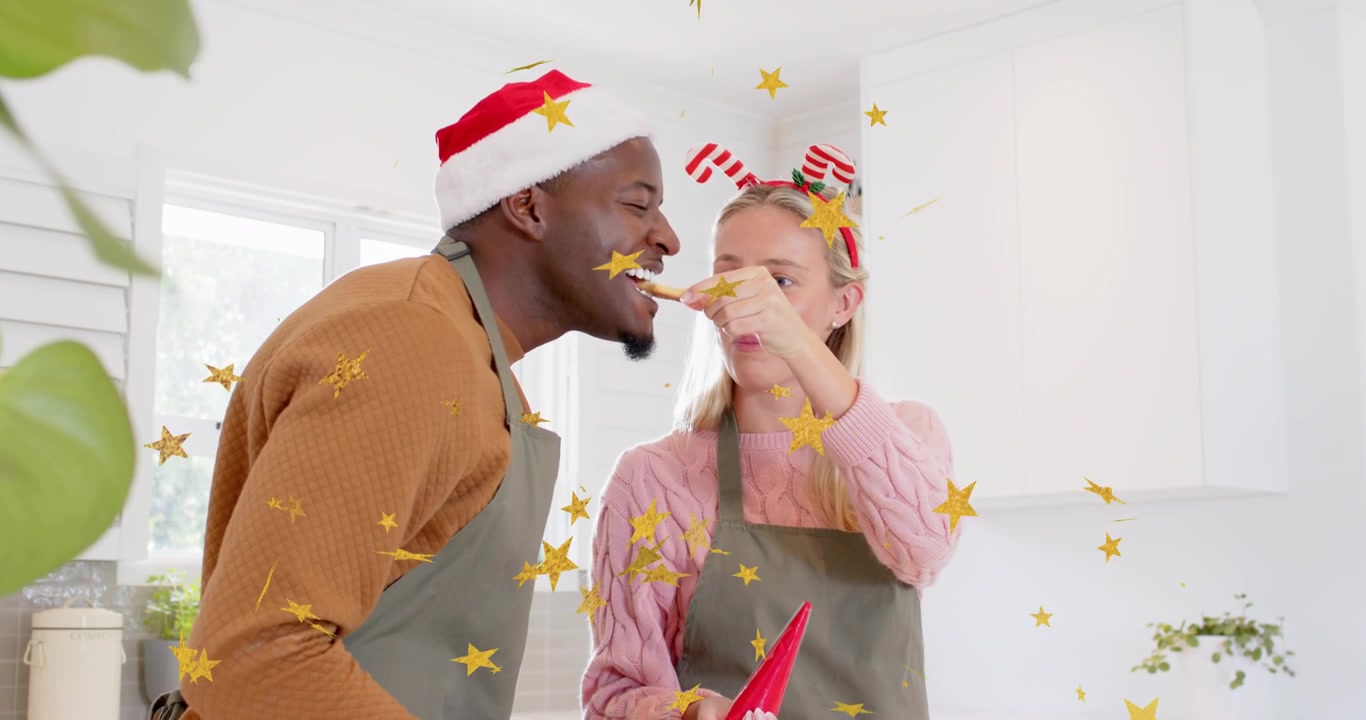 Man offering cookie then woman teasing him with pastry bag as confetti drifting during baking