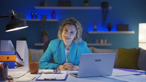 home office worker woman looking at camera with excitement and feeling happy.