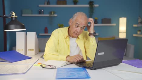 home office worker old man works confused.