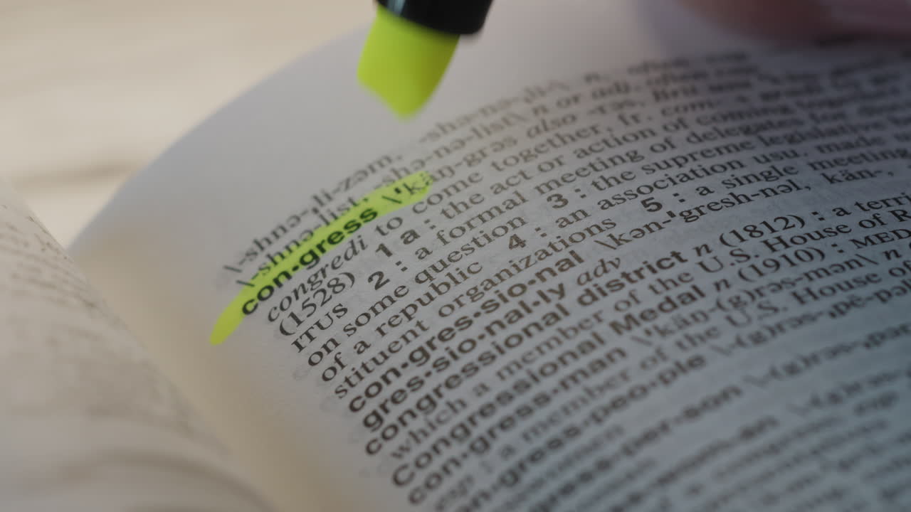 Congress Political Dictionary Highlighter Concept, highlighting a word in a dictionary to show it's definition